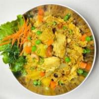 25. Pineapple Fried Rice · Fried rice with egg, pineapple, onion, raisin, cashew nut, peas and carrot, and curry powder.