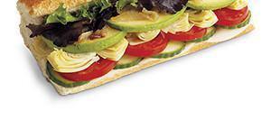 Yuppie Veggie Sandwich · Fresh avocado, provolone, roma tomatoes, mixed greens, crisp cucumber, artichoke hearts, car...