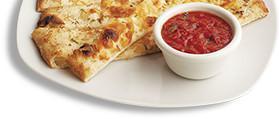 Parmesan Flatbread Sticks · Fresh baked pizza dough topped with housemade garlic butter and Parmesan cheese. Served with...