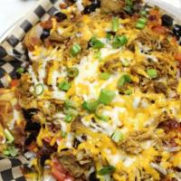 19th Hole Irish Nachos · Ground beef, shredded chicken or pulled pork over house chips double smothered in shredded c...