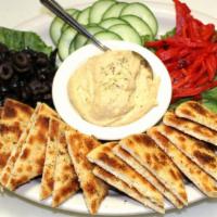 Hummus Platter · Creamy hummus, black olives, cucumbers, roasted red peppers and toasted pita bread seasoned ...