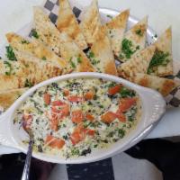 Spinach Artichoke Dip · Creamy artichoke and spinach dip made in-house. Baked with tomato and Parmesan cheese and se...