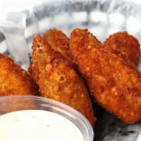 Jalapeno Poppers · 8 pieces. Cream cheese or cheddar cheese jalapeno poppers served with a side of your choice ...