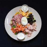 Chef Salad · Fresh romaine served with ham and turkey, topped with tomatoes, olives, hard-boiled egg, che...