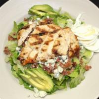 Cobb Salad · Grilled chicken, bleu cheese crumbles, red onion, avocado, egg, bacon and tomato. Served wit...