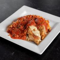 Chicken Parmigiana · Breaded chicken topped with cheese. Served with pasta and meat sauce.