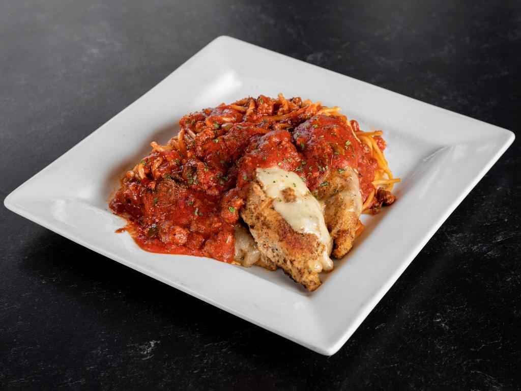 Chicken Parmigiana · Breaded chicken topped with cheese. Served with pasta and meat sauce.