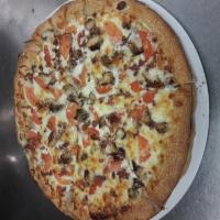 Chicken Bacon Ranch Pizza · Tomatoes, grilled chicken, bacon, ranch dressing and mozzarella cheese.