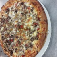 Steak Bomb Pizza · Shaved steak, mushrooms, onions pepperoni, peppers and mozzarella cheese with pizza sauce.