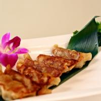 Gyoza (6) · Japanese style dumpling stuffed with chicken and pork. Served steamed or pan fried.