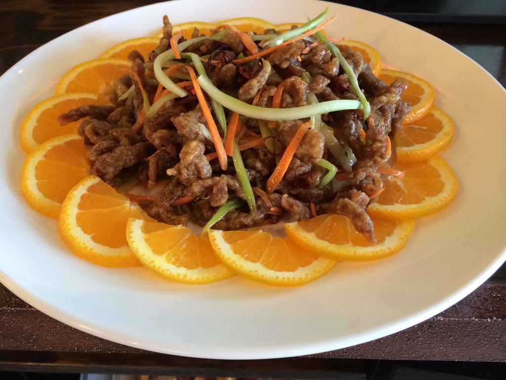 Shredded Beef · Crispy shredded flank steak quickly stir fried with carrot and celery in hot Szechwan sauce. Spicy.