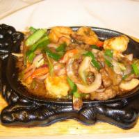 Sizzling Iron Plate · Choice of steak and scallop or shrimp. Flank steak and scallop or shrimp seasoned and cooked...
