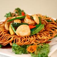 Seafood in the Basket · Shrimp and scallop sauteed with mixed veggies in brown sauce. Bottom served with crispy frie...
