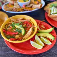 Tortilla Soup · Shredded chicken, queso blanco, fried chips, avocado slices
and veggies.