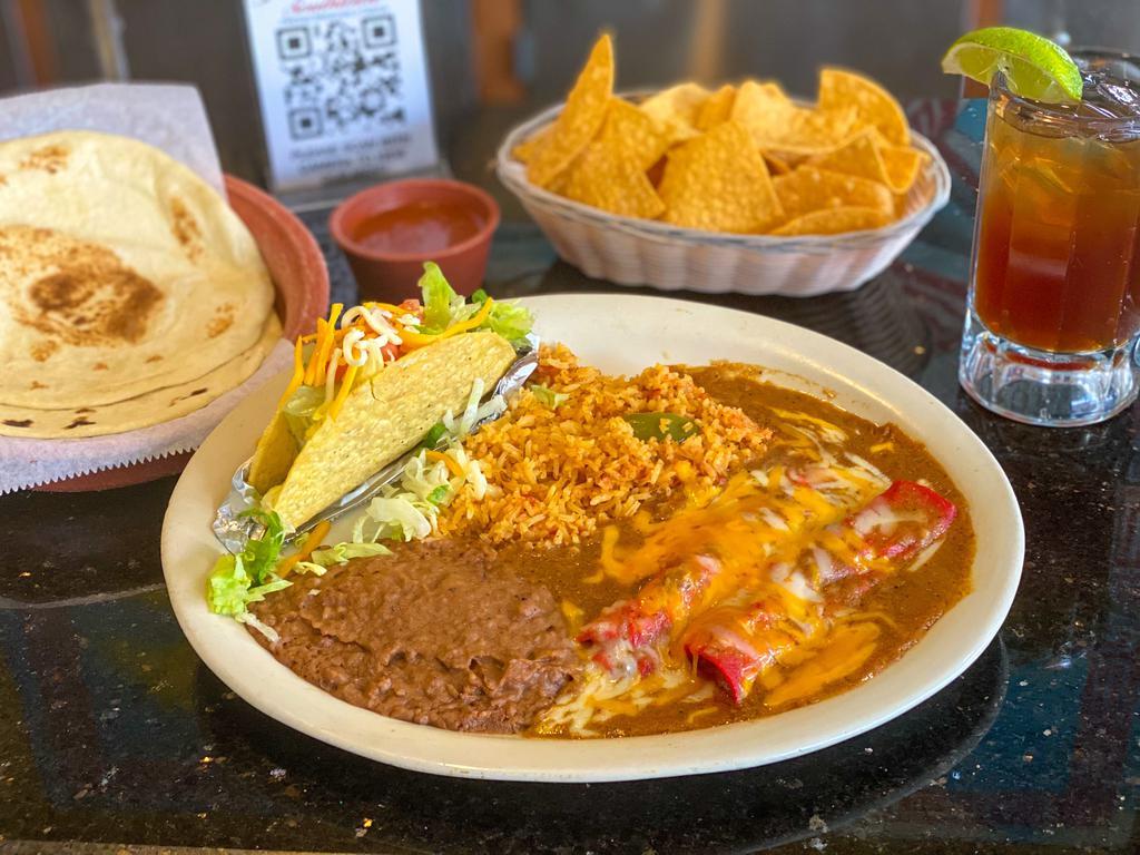 Jerry’s Mexican Dinner · 2 Cheese enchiladas with beef gravy, 1 soft or crispy taco with beef or chicken.