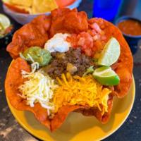 Regular Taco Salad · Taco salad bowl filled with lettuce and tomatoes, topped with your choice of shredded chicke...