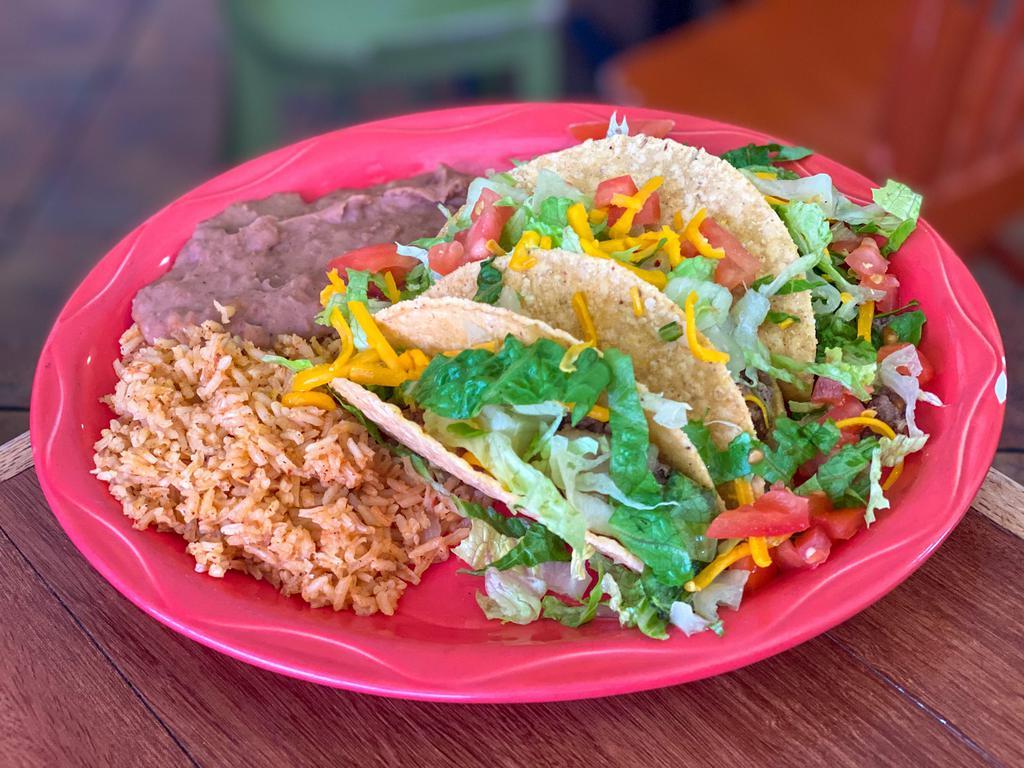 Crispy Taco Plate · 3 Tacos filled with your choice of picadillo or pollo guisado; topped with lettuce, tomato and cheese.