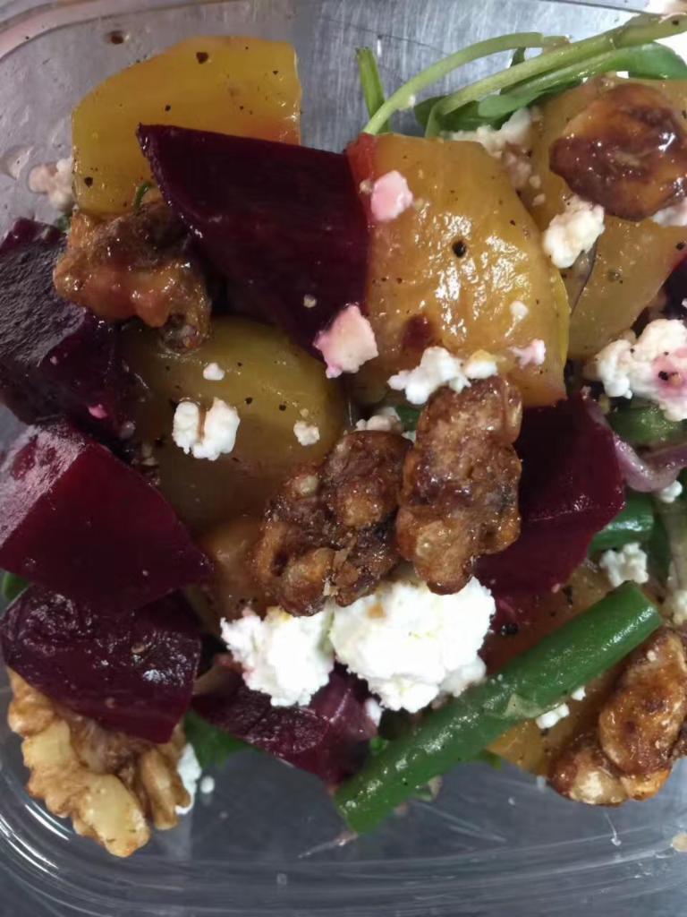 Beets Salad · Roasted red and golden beets, haricot vert, red onions, goat cheese, candied walnuts, sliced almonds, arugula and red wine vinaigrette.