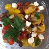 Tomato Salad · Cherry tomato, English cucumber, sliced red onion, olives, feta cheese, parsley, oregano, ol...