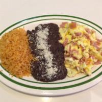 Huevos Revueltos con Jamon · Scrambled eggs with ham. Accompanied with rice, beans and corn tortillas.
