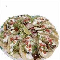 Tacos Americanos (3) · Your choice of ONE meat on corn tortillas topped with lettuce, tomato, sour cream and cheese.