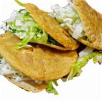 Gordita · Hand made corn tortilla stuffed with choice of meat, lettuce, sour cream and cheese. Guacamo...
