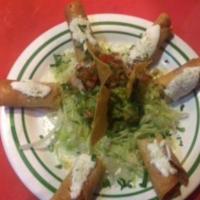 Flautas de Bistec  · 3 long Hard shell rolled tacos stuffed with steak topped with cotija cheese and sour cream. ...
