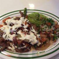 Alambre · Chicken or beef sauteed with pepper, onion, tomato, bacon and melted cheese. Accompanied wit...