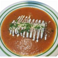 Chiles Rellenos · Roasted poblano peppers stuffed with queso fresco in a tomato sauce.  Accompanied with corn ...