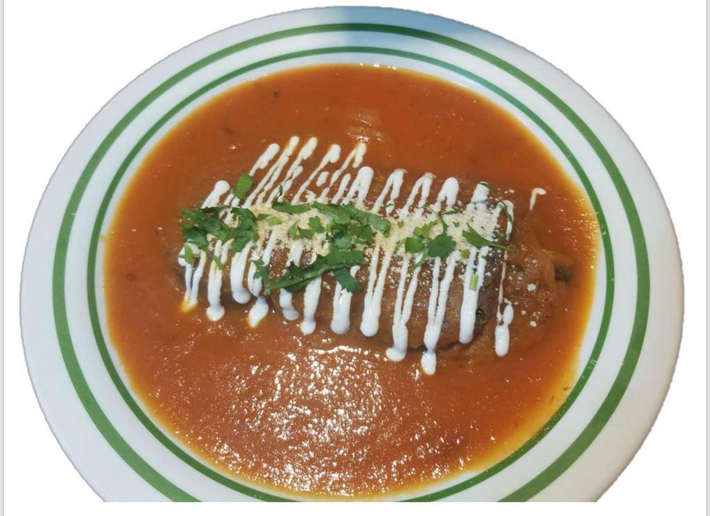 Chiles Rellenos · Roasted poblano peppers stuffed with queso fresco in a tomato sauce.  Accompanied with corn tortillas, rice and beans.