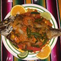 Mojarra a la Mexicana · Porgy mexican style. Served with rice, beans and tortilla.