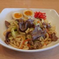 Yaki Udon Noodle Dish · Stir fired udon noodle with pork, vegetables, and soft boiled egg.