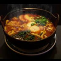 Miso Nikomi Udon Noodle Dish · Udon noodle with special miso flavor fish broth, fish cake, nappa, scallions, chicken, and e...