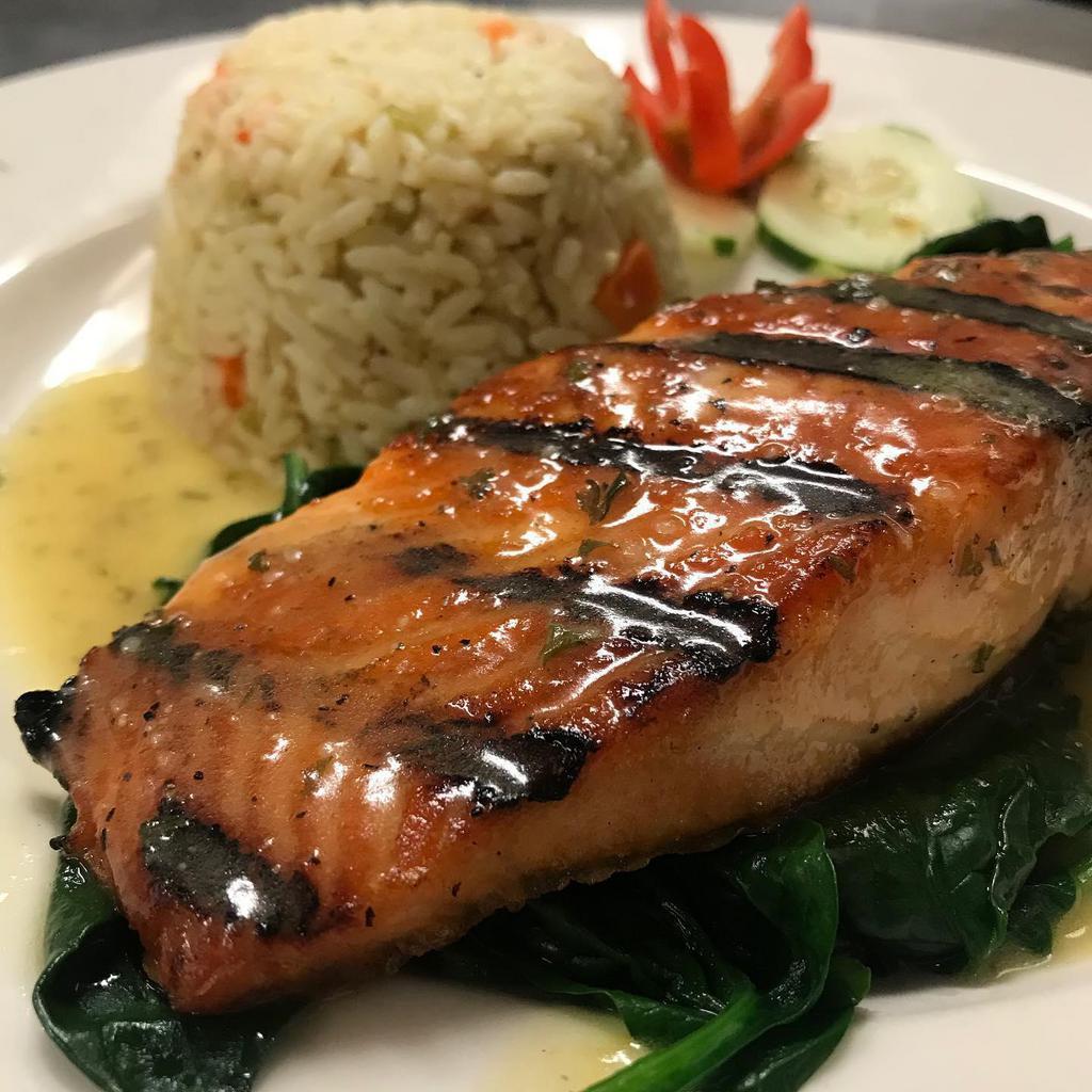 Grilled Salmon · Teriyaki glazed salmon served with mixed vegetables and basmati rice.