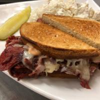 Rueben Sandwich · Pastrami or corned beef and melted Swiss cheese with kraut and Thousand Island dressing on r...