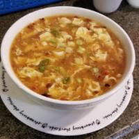 Hot and Sour Soup · Mild spicy sour soup cooked with egg and tofu. Spicy.
