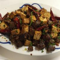 Dried Cooked Beef · Spicy. Beef shank stir-fried with dried tofu, chili peppers, and spicy seasoning.
