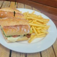 Crispy Chicken Sandwich · Crispy chicken breast, melted mozzarella cheese, lettuce, tomatoes, bacon and mayonnaise on ...