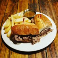 French dip Sandwich · Thinly sliced roast beef on a baguette with a side of au jus.Served with French fries, tater...