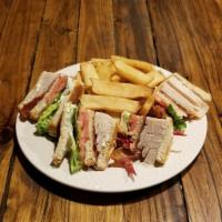 Turkey Club · Thinly sliced turkey with lettuce, tomato, bacon and mayonnaise on white or whole wheat toas...