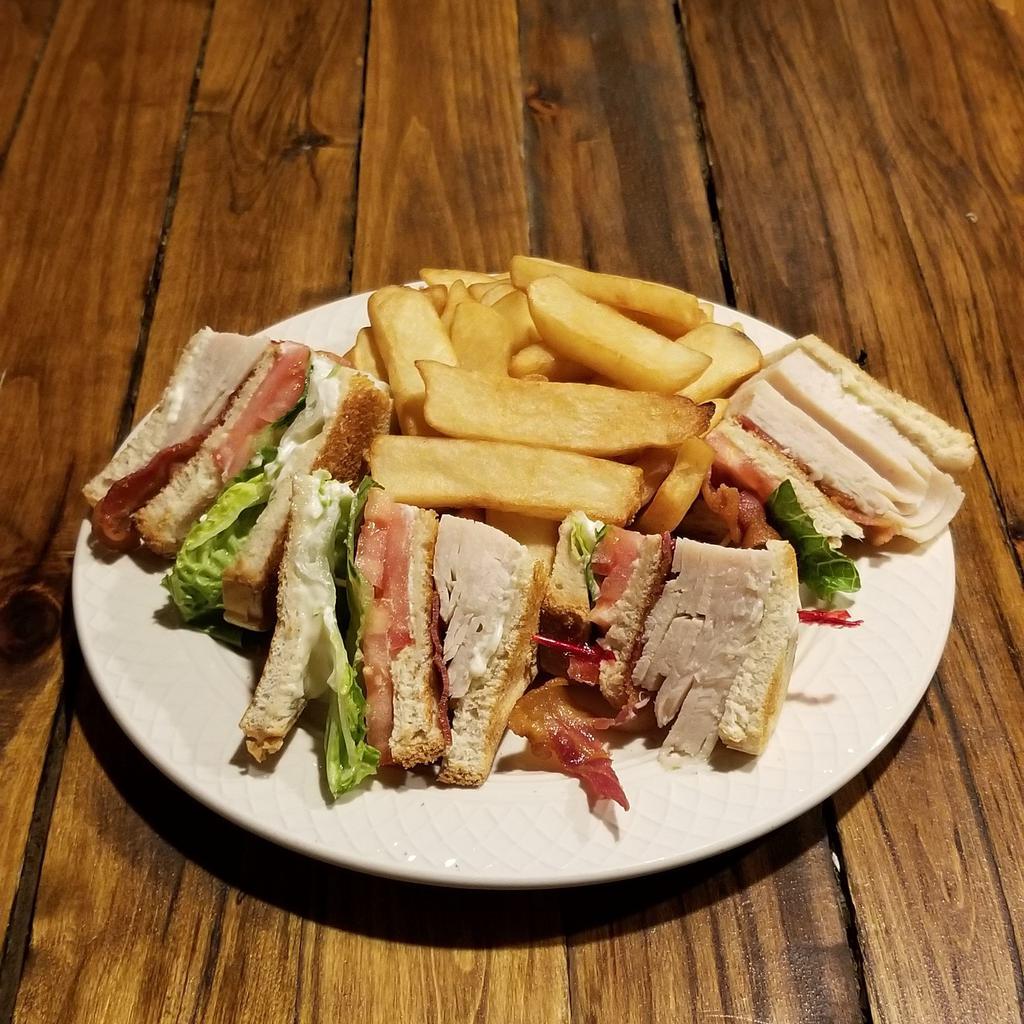 Turkey Club · Thinly sliced turkey with lettuce, tomato, bacon and mayonnaise on white or whole wheat toast. Served with  French fries, tater tots, onion rings or house salad.