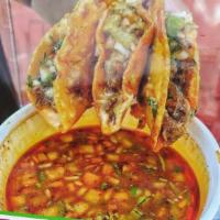 Tacos Birria  · Three soft corn tortillas comes with beef meat, onions, cilantro and cheese; served with con...