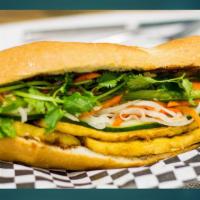 Miso Tofu VEGAN Sandwich · Fresh baked French bread, miso tofu with pickled carrots, cucumber, and cilantro