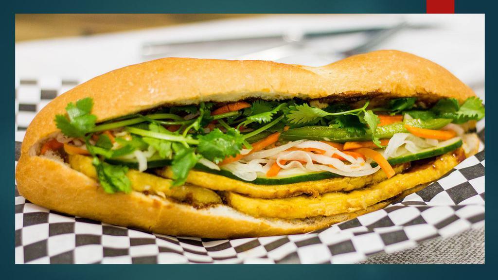 Miso Tofu VEGAN Sandwich · Fresh baked French bread, miso tofu with pickled carrots, cucumber, and cilantro