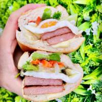 Spam & Egg Sandwich · Fried spam, two eggs, fresh and pickled veggies, mayo on French bread.