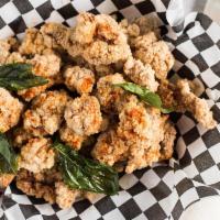 Popcorn Chicken · Hand-cut thigh meat and house spice.
