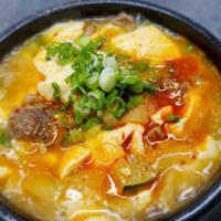 Soon Dubu Jjigae · Organic soft tofu stew cooked with vegetables in a earthenware bowl. (Spicy or NOT Spicy) 
A...