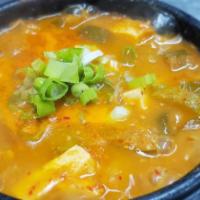 Doenjang Jjigae · Fermented soy bean paste stew with firm tofu and mixed vegetables, ubiquitous with Korean cu...