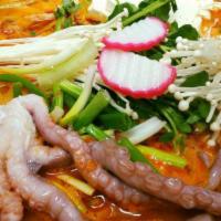Hae Mul Jeongol · A fresh variety of mixed seafood including shrimp, cod, squid, octopus and crab cooked with ...