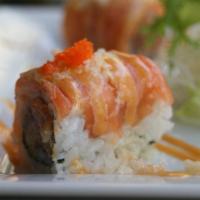 Spicy Girl Roll · Spicy tuna, salmon sashimi, thinly sliced lemon, honey spicy sauce, and tempura flakes.